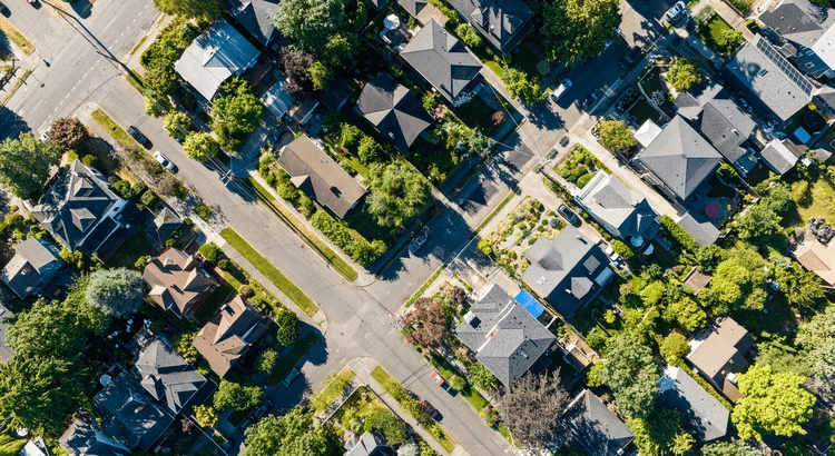 Title card for the article: Is the Housing Market Going To Crash? Here’s What Experts Say